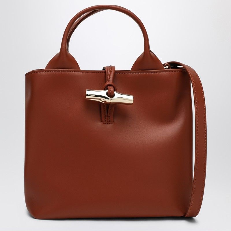 LONGCHAMP Mini Leather Handbag with Dual Handles and Adjustable Strap