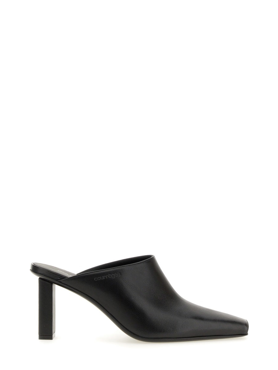 COURREGÈS Sleek Flat Pumps