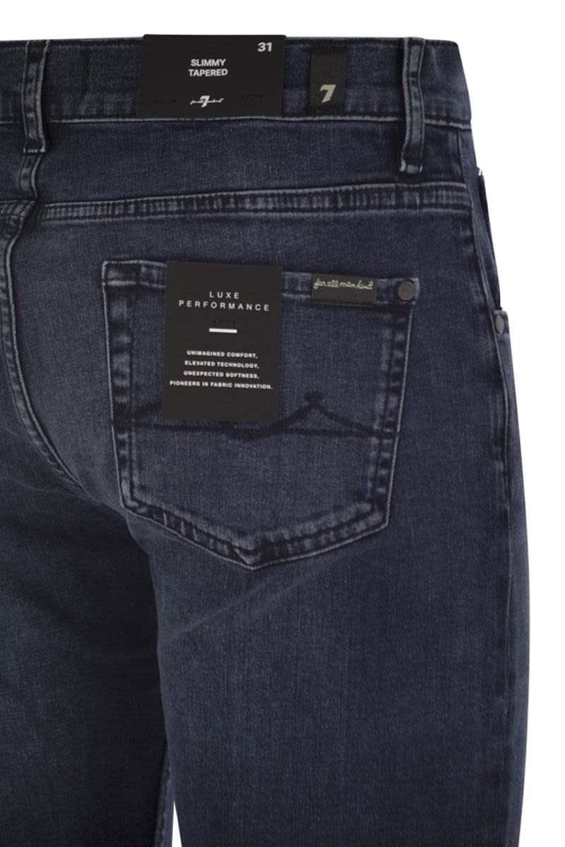 7 FOR ALL MANKIND Slimmy Tapered Medium-Waisted Jeans