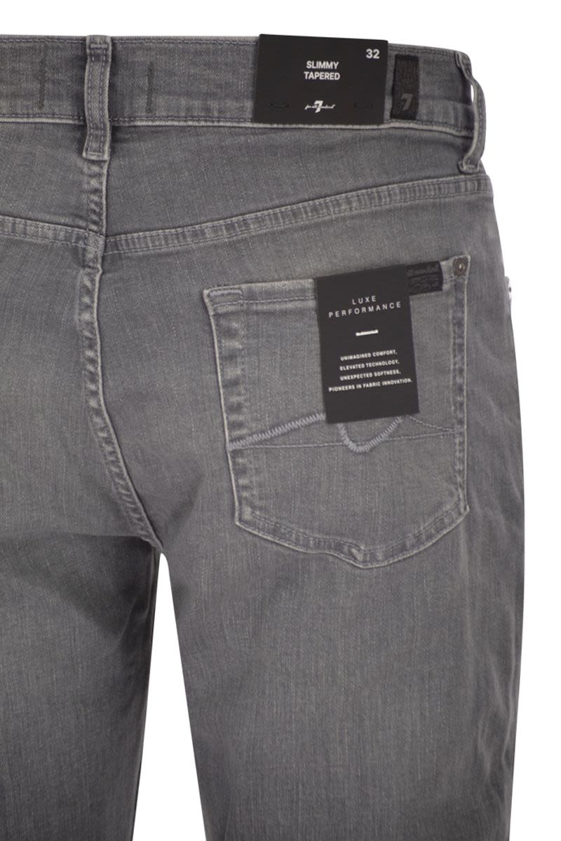7 FOR ALL MANKIND Slimmy Tapered Mid-Rise Jeans - Men