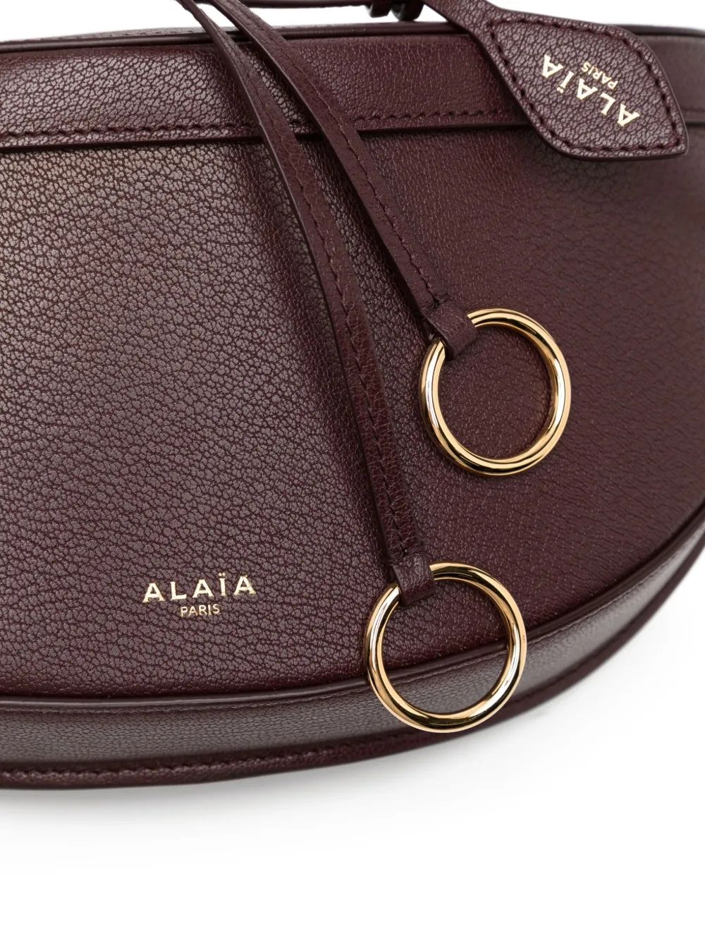 ALAIA Curved Mini Crossbody Handbag with Adjustable Strap