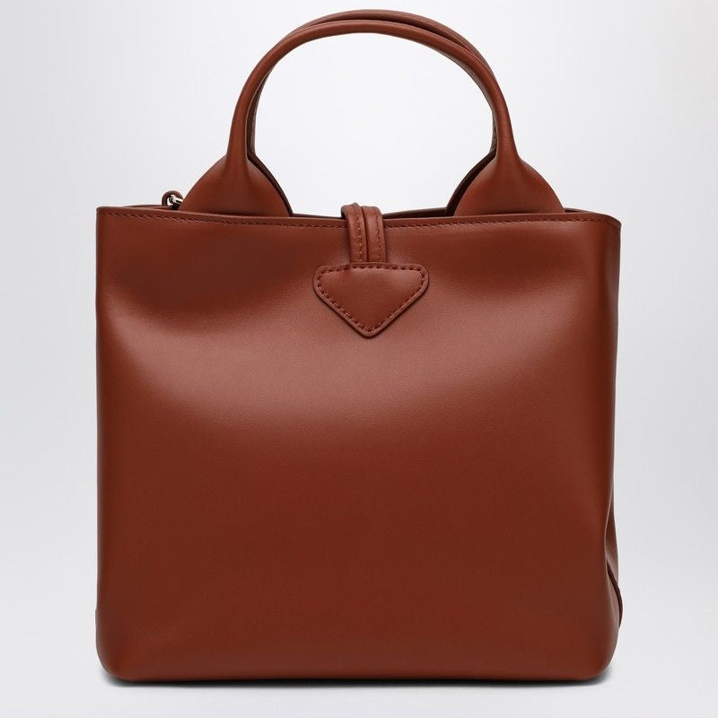 LONGCHAMP Mini Leather Handbag with Dual Handles and Adjustable Strap