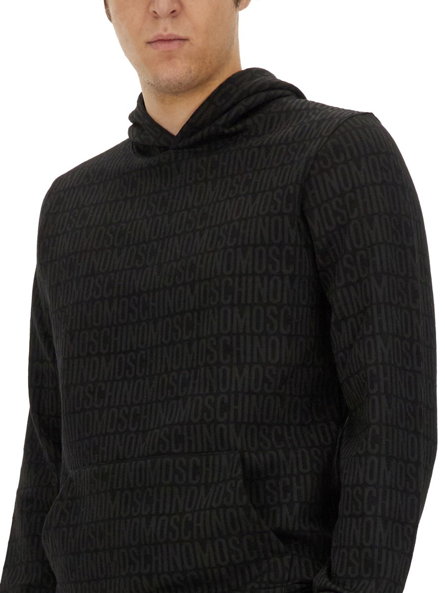 MOSCHINO COUTURE All-Over Logo Sweatshirt for Men - Size L