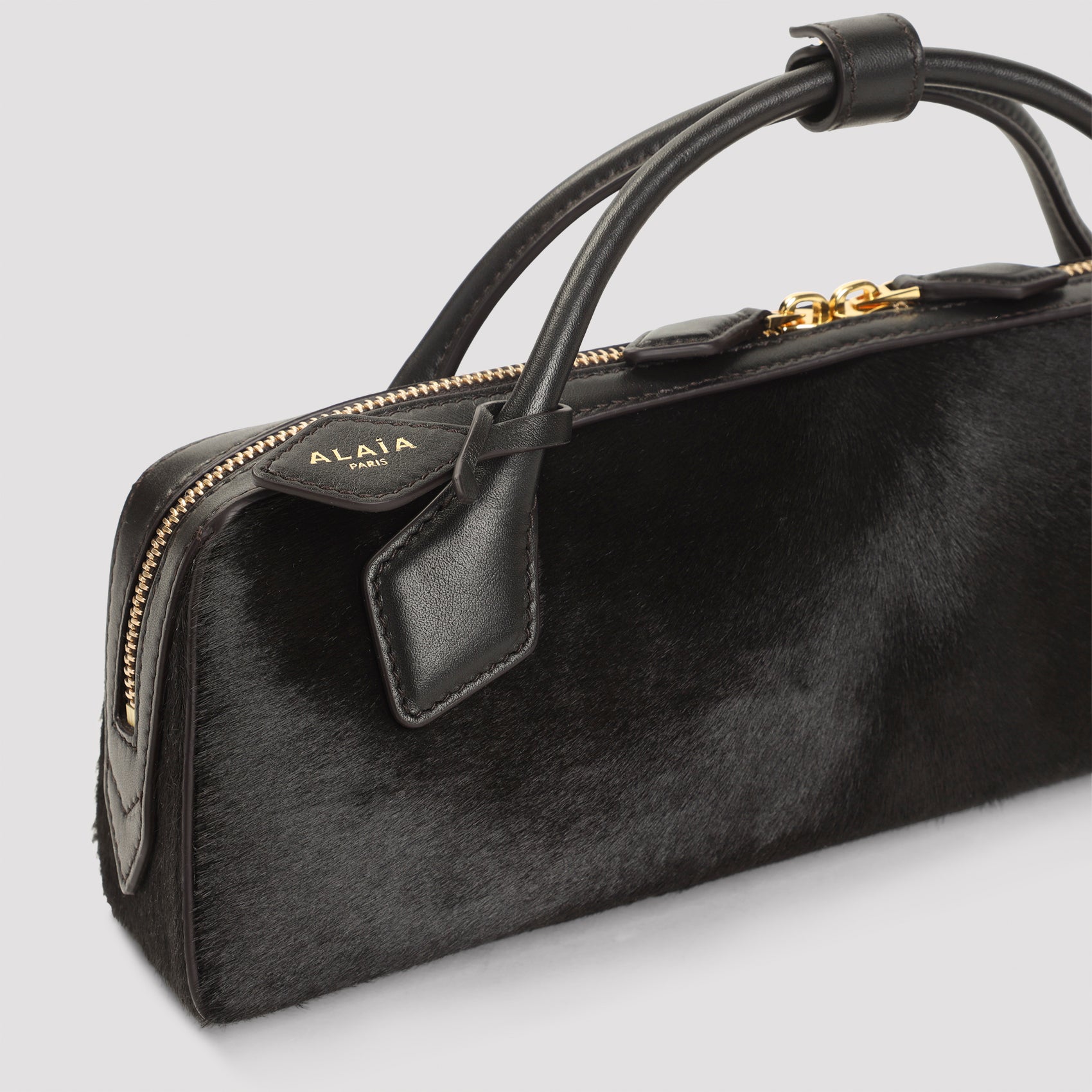 ALAIA Mini Cavallino Leather Clutch