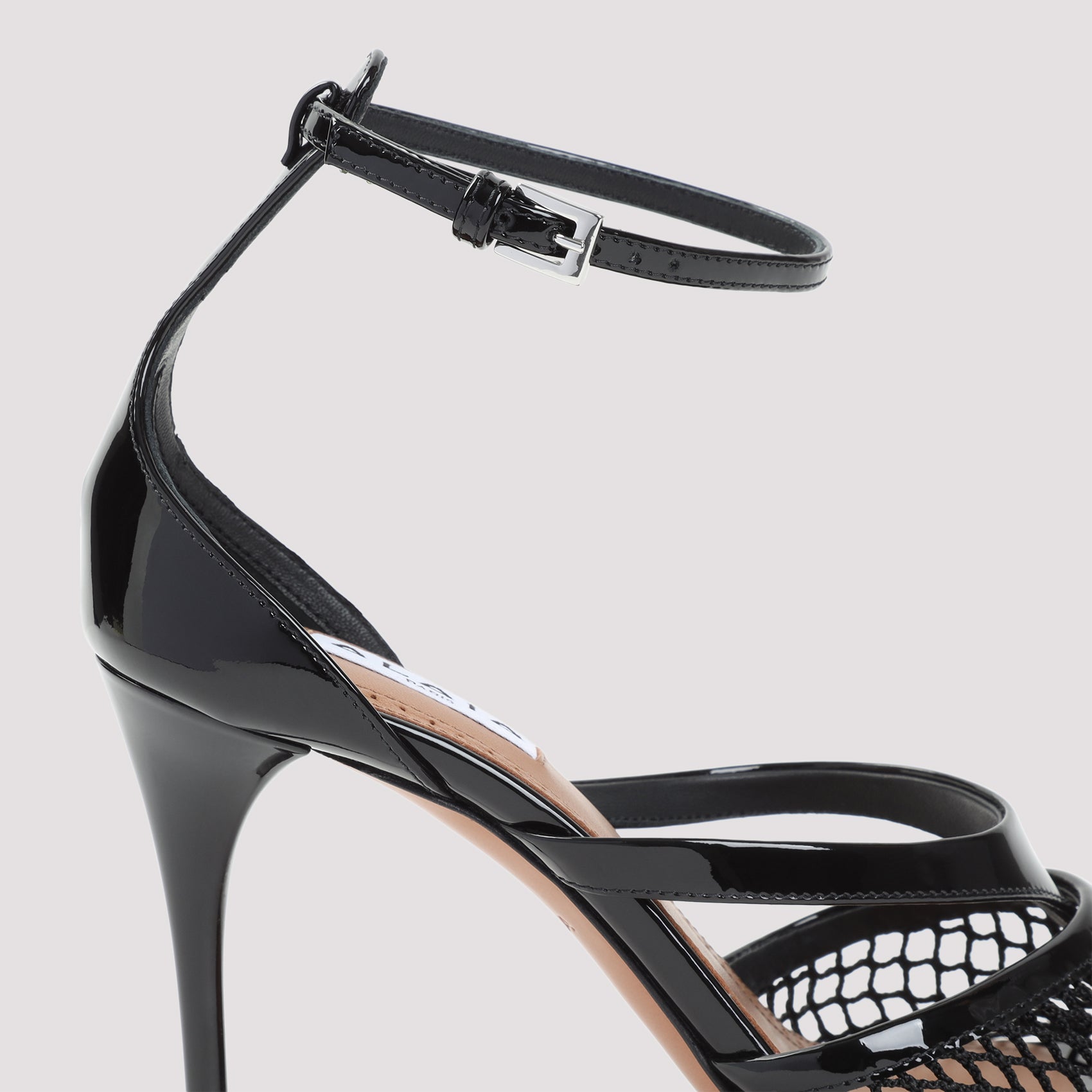 ALAIA Elegant Stiletto Thong Sandals with Adjustable Ankle Strap