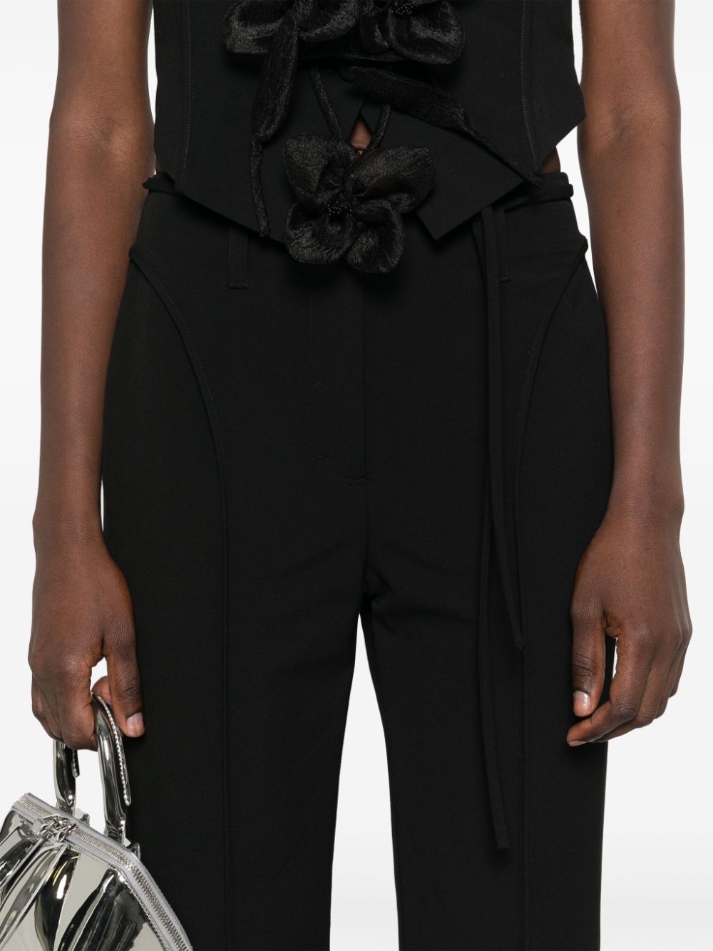 ROTATE High-Waisted Slim Fit Flare Trousers with Floral Tie Detail